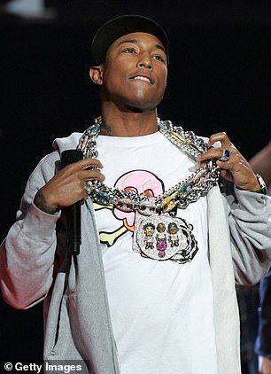 Brining the bling: Pharrell Williams debuted his NERD pendant and chair in 2005;  he was photographed at the American Music Awards in November 2005