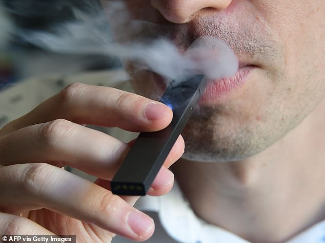 Researchers found that vapers suffered more inflammation in their lungs than people who smoke regular cigarettes (file photo)