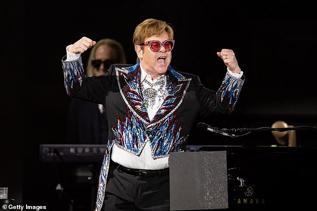 Putting on a show: Sir Elton John performing at Dodger Stadium in Los Angeles as part of his Farewell Yellow Brick Road tour last year in November