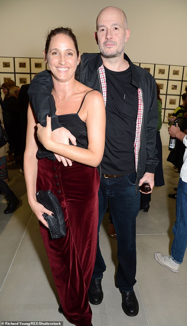 Jake Chapman, pictured with Rosemary Ferguson, left, has modified copies of Prince Harry's memoir 'Spare', turning him into a multi-eyed green monster.