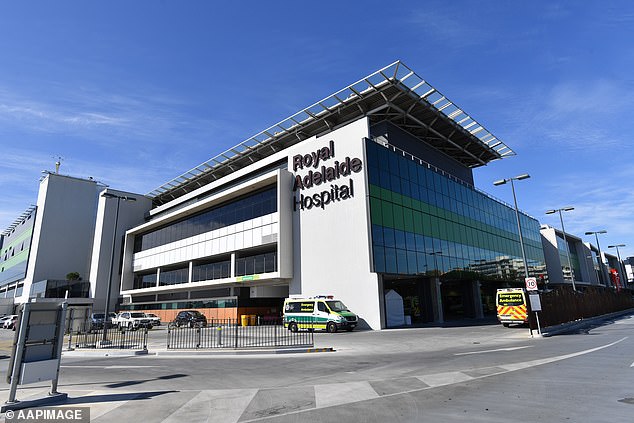 A 17-year-old Adelaide boy was rushed to Royal Adelaide Hospital (pictured) after falling out of the back of a moving car on Saturday night.