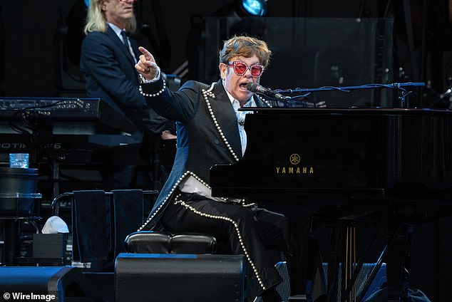 Elton John's concert in Auckland was canceled on Friday after torrential rain lashed the New Zealand city.  Elton is pictured