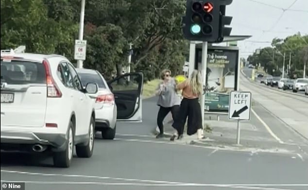 The footage captured the moment two women exchanged blows on a busy street in front of horrified motorists.