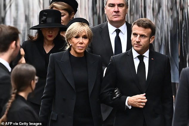 Sources claim that the French president engineered the move by taking a long walk with his wife, forcing the government to place a limousine on him.  Pictured: Macron and his wife Brigitte attend the Queen's state funeral.