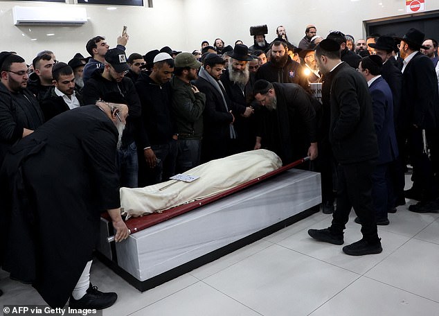 Family and friends carry the body of 14-year-old Asher Natan, the victim of a shooting attack in East Jerusalem.