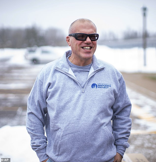 Thomas Rhodes smiles as he walks out of a Minnesota state prison Friday after serving 25 years in prison.