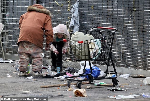 The federal government will invest $5 million over the next four years to research safe drug injection sites in New York and Rhode Island.  Pictured: Homeless people in Philadelphia, Pennsylvania, openly use drugs on the street