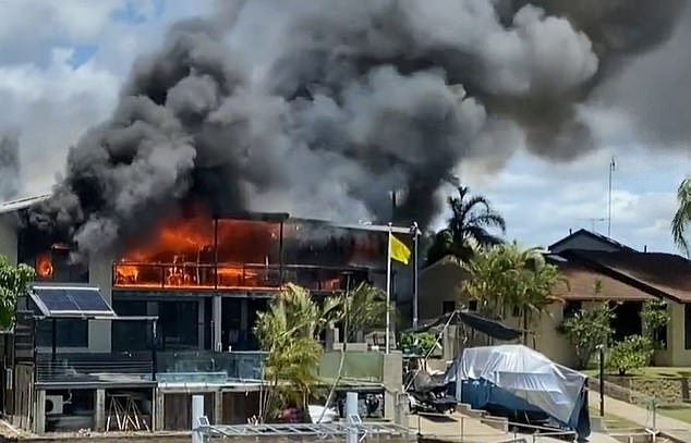 The fire quickly engulfed the luxury beachfront property on the Gold Coast (pictured)