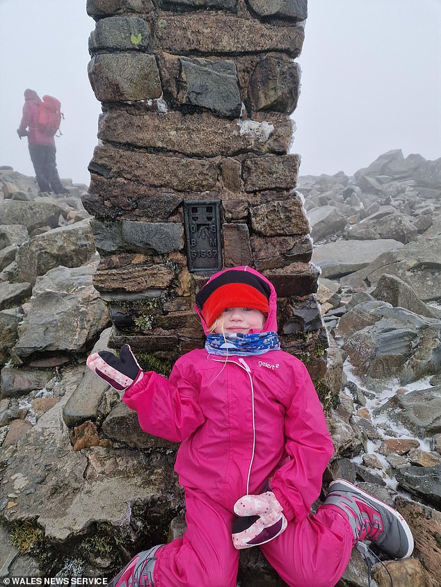 Five-year-old Seren Isla Price (pictured) scaled Britain's highest peaks in less than 48 hours with her father Glyn.