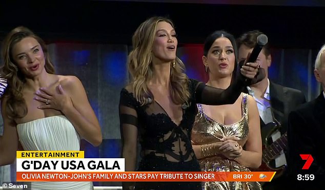 American singer Katy Perry (second from right) had no idea what the lyrics to I Still Call Australia Home were when she joined Miranda Kerr (left) and Delta Goodrem (centre) onstage at the G'Day USA gala in Los Angeles on Saturday.