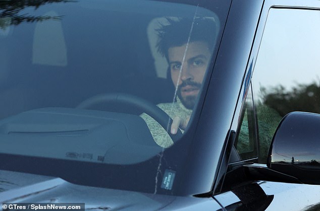 Errands: Gerard Piqué was caught driving through Barcelona on Friday