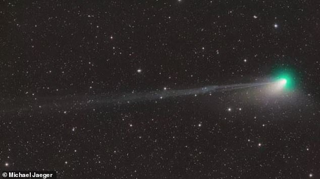 Fascinating: This spectacular image shows the moment the tail of a 'once-in-a-generation' green comet appears to break off in the night sky. Astronomers think the space rock suffered a 'disconnection' event caused by turbulent space weather