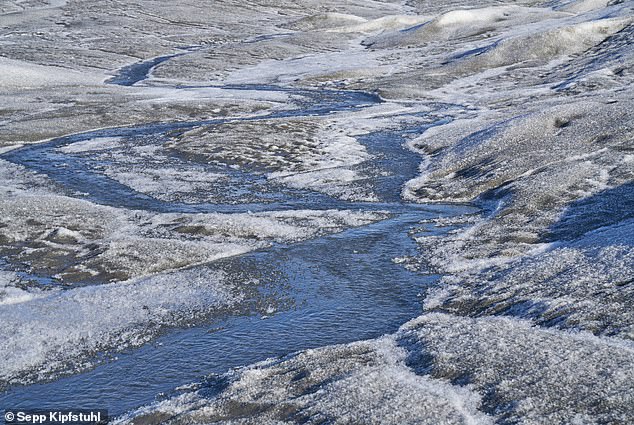 Concern: Greenland's ice sheet is hotter than ever and will cause global sea level to rise 20 inches by 2100 if it continues to warm at the same rate, scientists warn