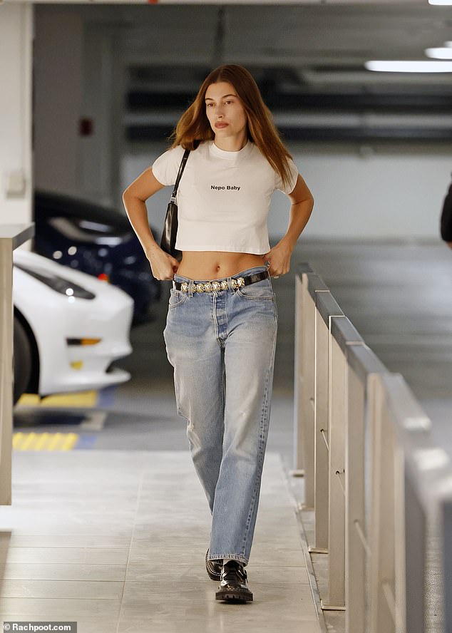 Embracing the label!  Hailey Bieber, daughter of actor Stephen Baldwin, proudly wore a 'Nepo Baby' cropped T-shirt as she stepped out in Los Angeles on Friday.