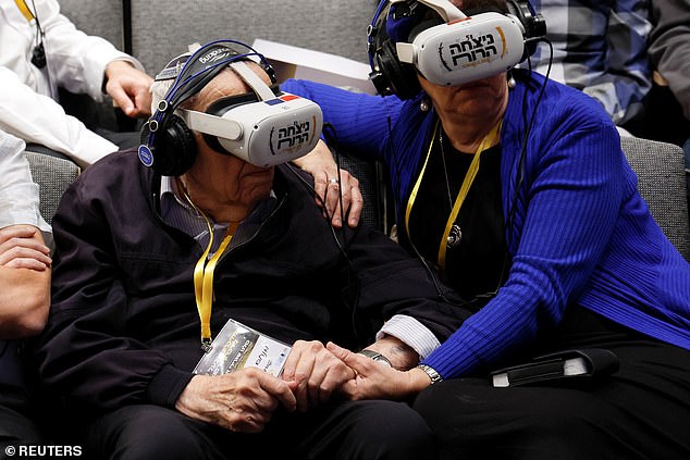 Holocaust survivor Menachem Haberman, 95, participates in a virtual guided tour of the former Nazi concentration camp Auschwitz-Birkenau, where he was deported to in 1944