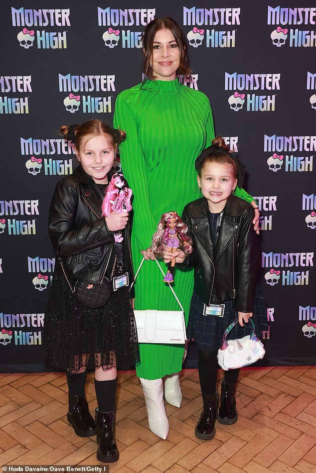 Mom: Imogen Thomas wowed in a green midi dress as she made a rare appearance with daughters Ariana, nine, and Siera, six, at the Monster High Freaky Friday party.