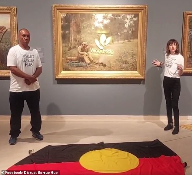 Ceramic artist Joana Partyk and Ballardong Noongar man Desmond Blurton sprayed a Woodside logo on the Down on His Luck painting (above) on Thursday.