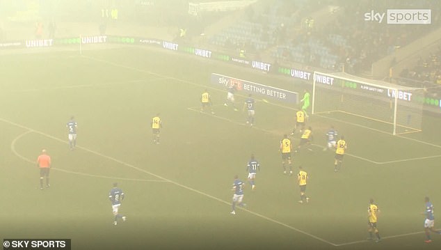 Ipswich fans mocked the decision to play on in thick fog at Oxford on Saturday (above)