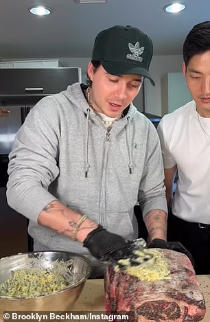 Channeling: Brooklyn Beckham appears to channel viral TikTok sensation Salt Bae by rocking a pair of black gloves in her latest cooking tutorial.