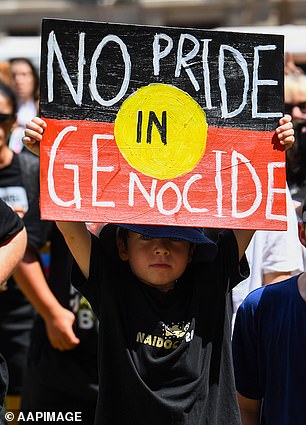 Protesters took to the streets in every state and territory (pictured, a young protester at a demonstration in Brisbane)