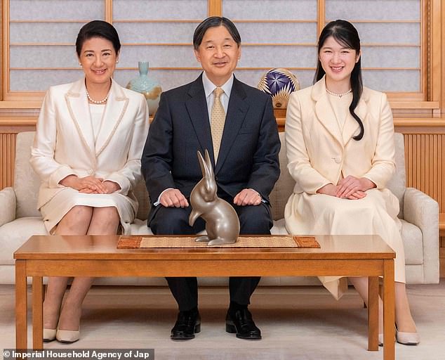 Japan's Emperor Naruhito appeared in high spirits as he posed for a New Year's portrait at the Imperial Palace in Tokyo with his wife and daughter.