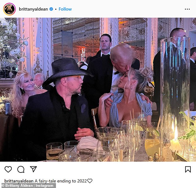 Too friendly?  Country singer Jason Aldean was mercilessly mocked on social media after his wife shared a photo of Donald Trump kissing her on the forehead at a New Year's Eve party.