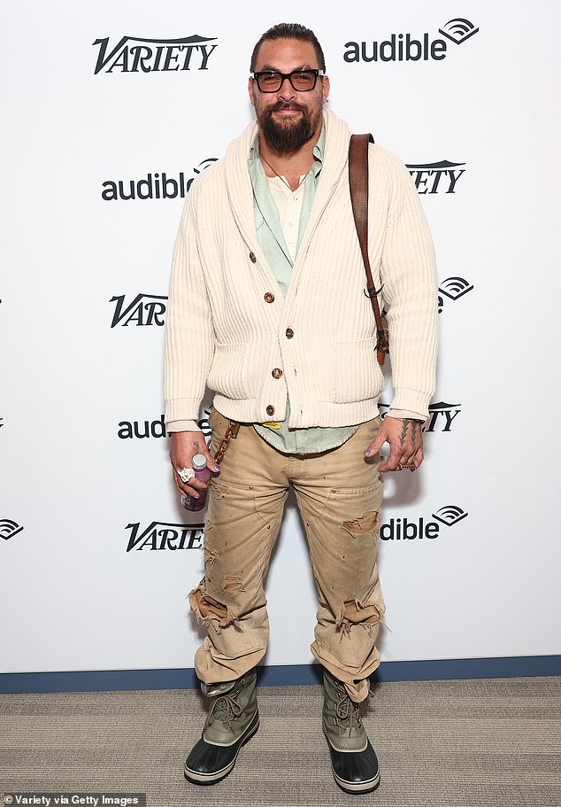 Extra cozy: Jason Momoa donned a chunky white cardigan while out at Variety Sundance Studio on Friday