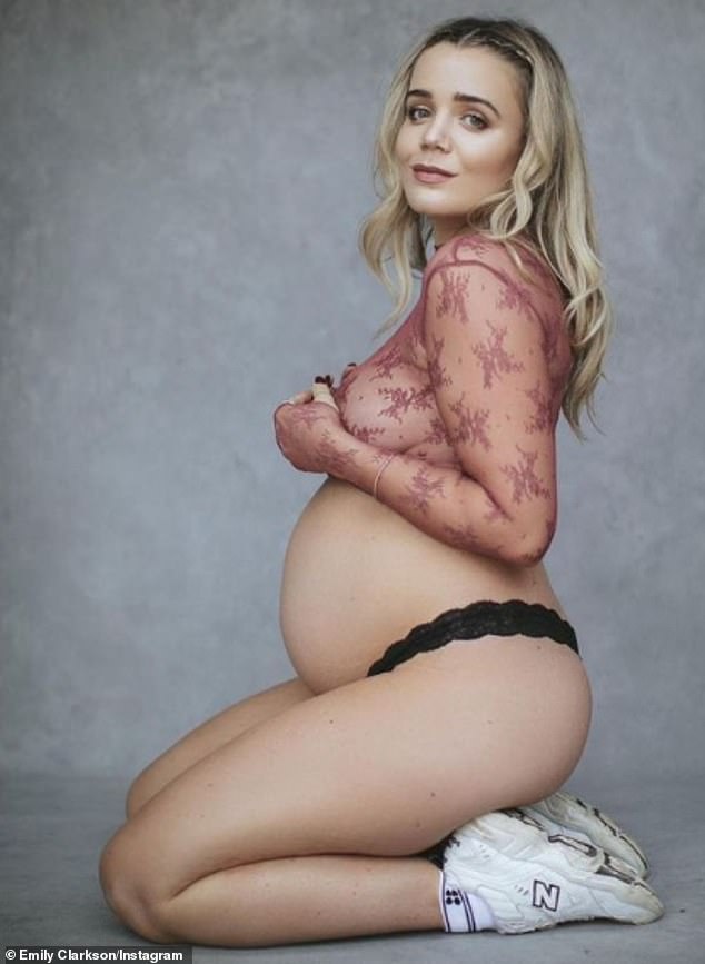 She's waiting: Author and body positivity blogger Emily Clarkson has shared photos of her burgeoning tummy while wearing a lilac mesh crop top.