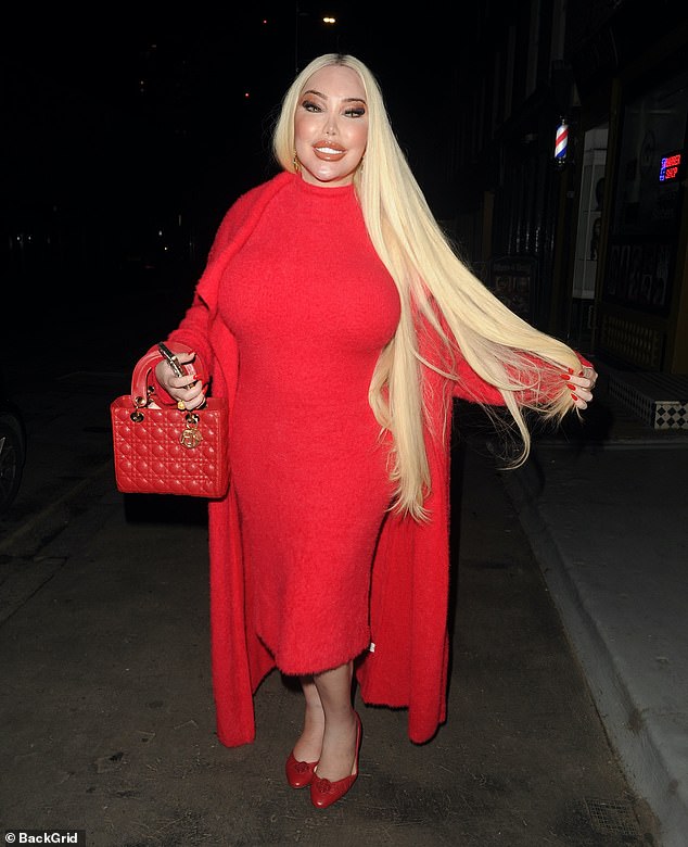 Lady in red: Jessica Alves, 39, showed off her new platinum locks after leaving Retrohair Church Street, London on Friday night