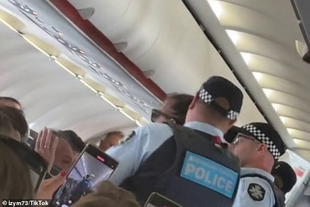 Passengers can be heard singing and laughing as the Lennox Heads woman was thrown off a plane flying from the Gold Coast to Avalon on Monday (pictured)