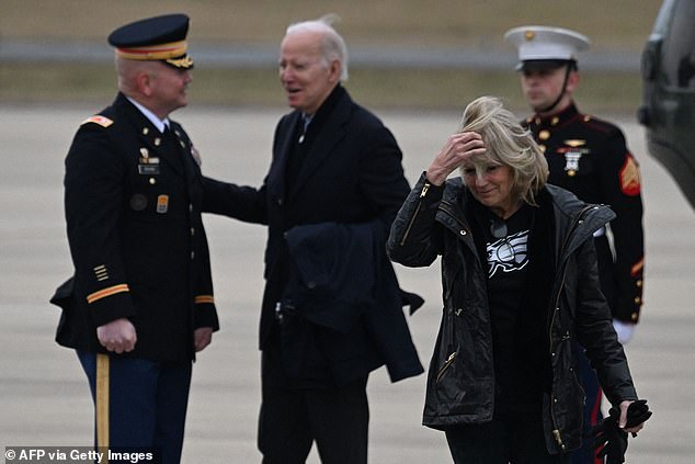 First lady Jill Biden (right) wearing Eagles gear as she arrived at the Delaware Air National Guard base on Sunday.  She peeled away from President Joe Biden (left) and headed for Lincoln Financial Field