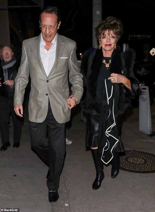 Icon: Joan Collins, 89, stunned in black on Wednesday night while out for a romantic dinner with her fifth husband, Percy Gibson, 58.