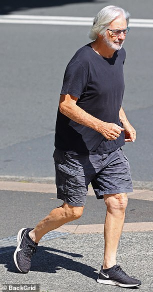 Australian actor John Jarratt was seen in a rare public outing in Sydney on Tuesday (left)