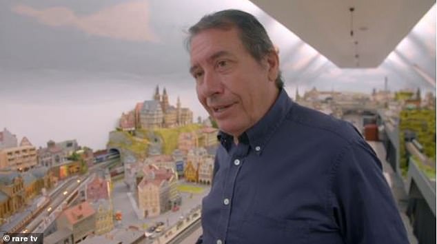 Giant!  Jools Holland has shown off the incredible 90ft minitrain he's created in the penthouse of his Kentish mansion