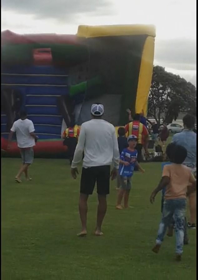 The jumping castle in the Matua New Year's Eve celebration incident in Tauranga, New Zealand, is shown just as the wind was about to lift it off the ground.