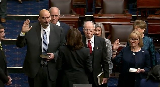 Vice President Kamala Harris swore-in Pennsylvania's newest Democratic senator on Tuesday -the state's former Lt. Gov. John Fetterman (left)