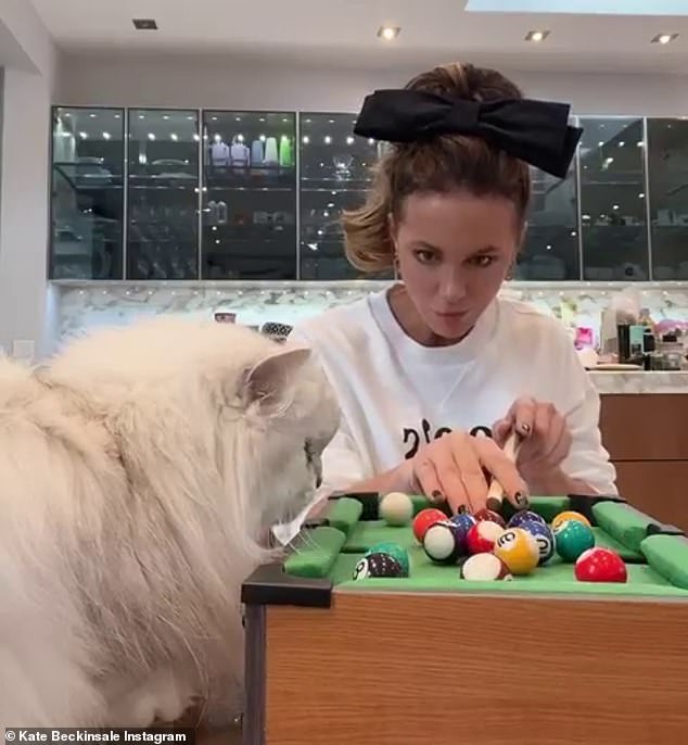 Unique: Kate Beckinsale got competitive while playing pool with her cat Willow in a slew of hilarious Instagram videos on Monday