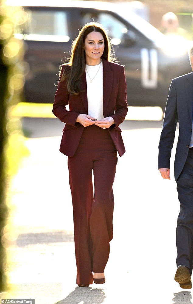 The Princess of Wales sparkled in a burgundy gown when she arrived at Hampton Court Palace this afternoon.