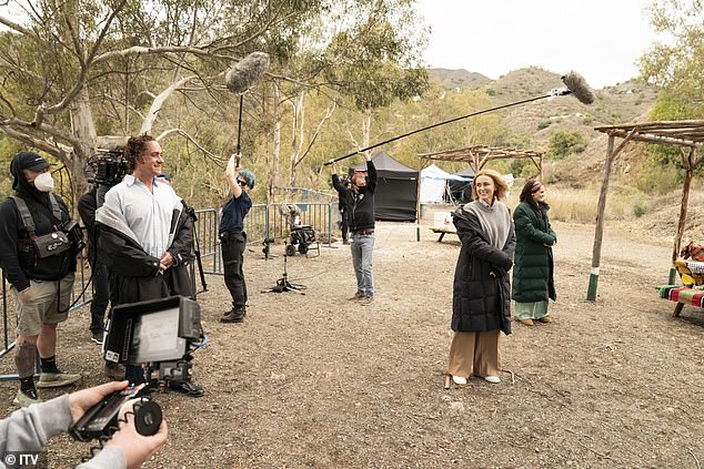 Husband in real life: Keeley Hawes is seen smiling at her husband Matthew Macfayden in exclusive behind-the-scenes snaps of their new ITV drama Stonehouse