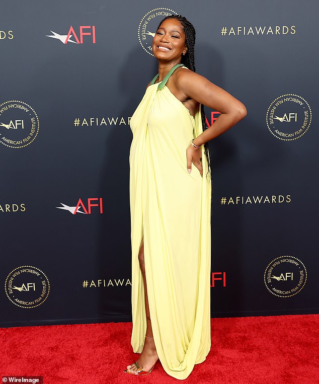 Stunning: Keke Palmer, 29, covered her growing baby bump in a gorgeous yellow dress on Friday as she attended the AFI Awards luncheon