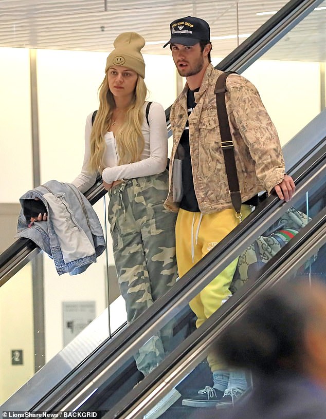 New couple: Kelsea Ballerini, 29, and Chase Stokes, 30, couldn't keep their hands off each other when they arrived at the Los Angeles airport on Saturday.