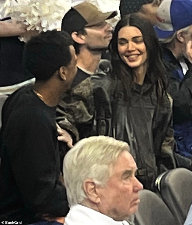 Having fun: Kendall Jenner shared a laugh with her old friend Taco Bennett as they enjoyed a high school basketball game at UCLA on Friday