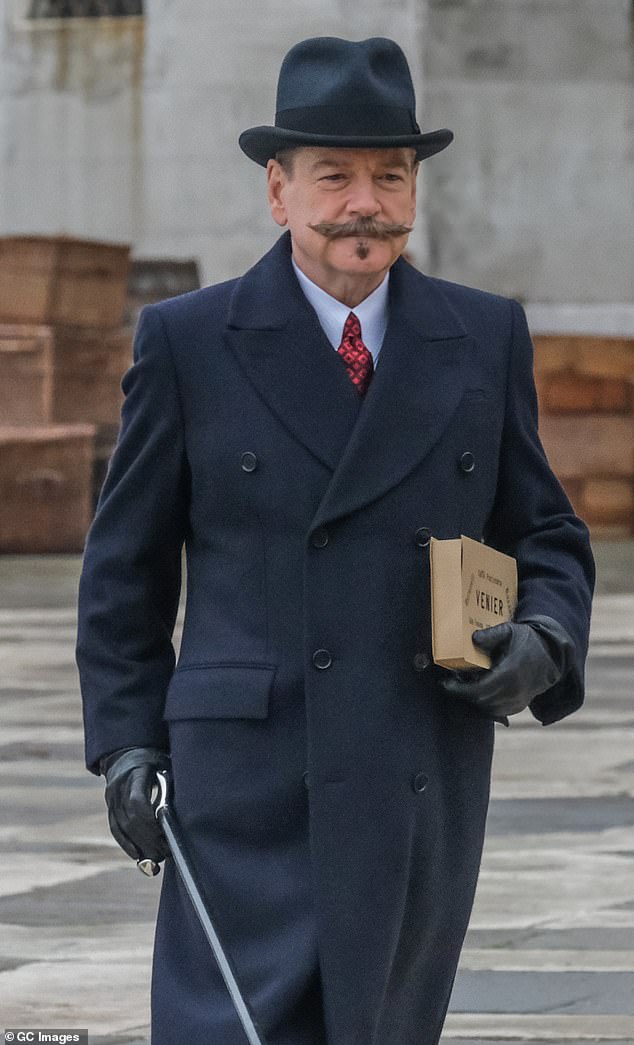 Kenneth Branagh sported his character Hercule Poirot's trademark mustache on Monday as he continued filming A Haunting in Venice.