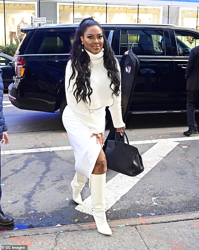 The Latest: Kenya Moore, 51, says her divorce from ex-husband Marc Daly has stalled due to the lack of a prenuptial agreement.  She was photographed last week in New York.