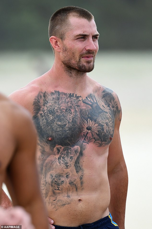 Key Titans recruit Kieran Foran was impossible to miss when he showed off his striking tattoo on a Gold Coast beach on Thursday.