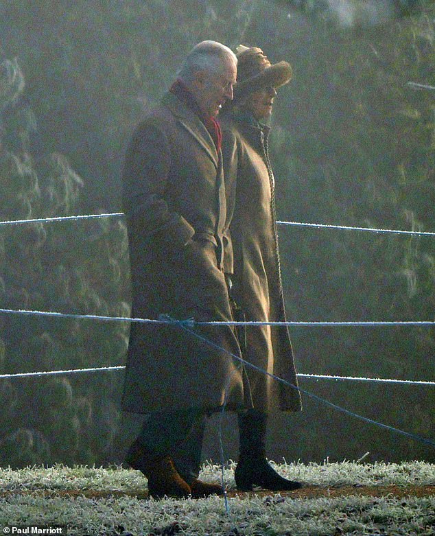 King Charles, 74, bundled up in a long brown coat and red scarf as he walked up the lane to St Mary Magdalene Church in Norfolk.