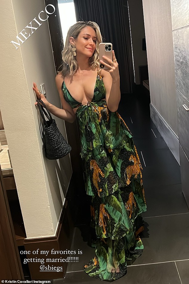 Having fun: Kristin doused in a sizzling nature print maxi dress as she posed up a storm for her Insta Stories on Friday