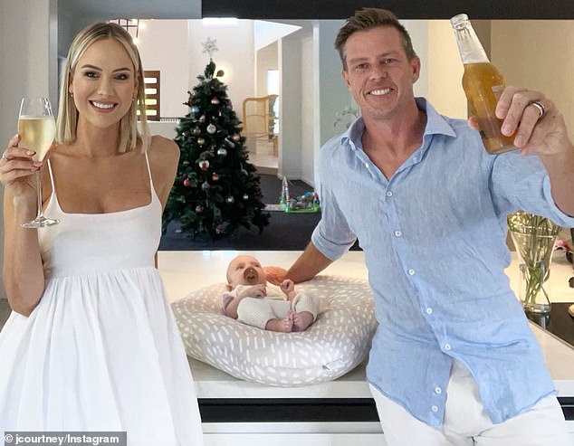 The Supercars driver shared a photo on Instagram capturing the lovebirds at their Gold Coast home elevating their drinks to 2022.