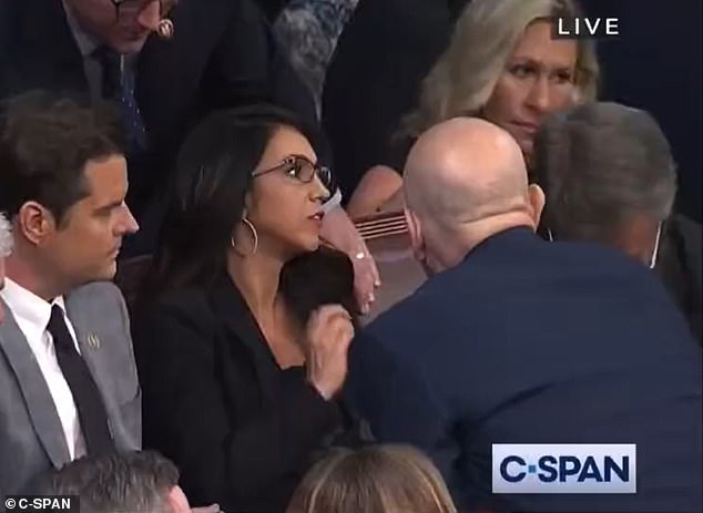 US.  Rep. Marjorie Taylor Greene (top right) could be seen rolling her eyes as she approached Republican Reps. Matt Gaetz (left) and Lauren Boebert (center).