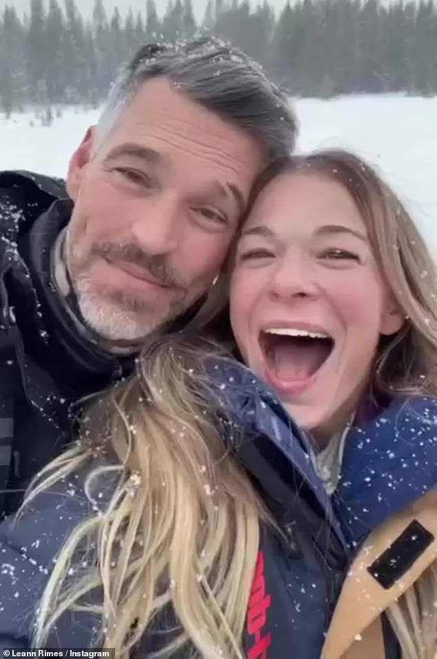 Fun in the snow: LeAnn Rimes, 40, took to Instagram to share romantic snaps with her husband Eddie Cibrian, 49, in snowy Montana on Monday.